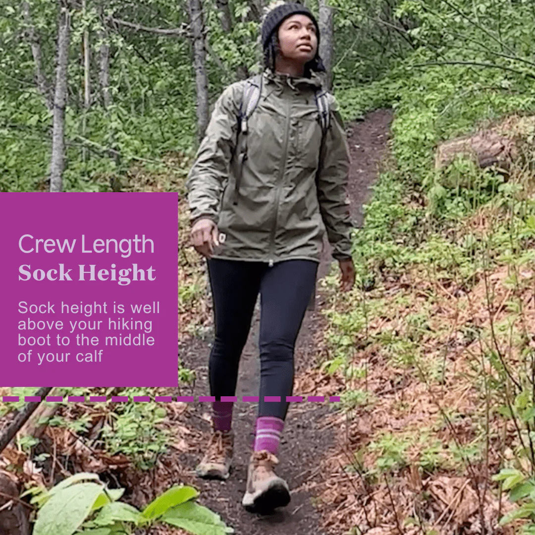 woman on trail wearing pink socks