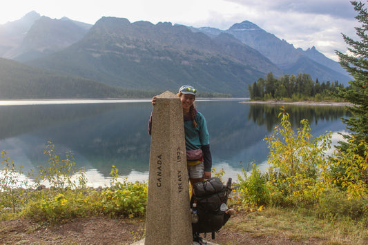 Female hiker carrying Aspen backpack designed for women’s fit