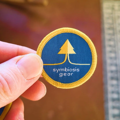 symbiosis gear logo round patch