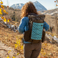 woman wearing the aspen backpack