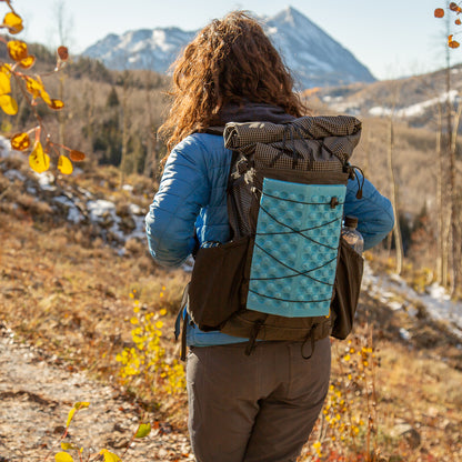 woman wearing the aspen backpack